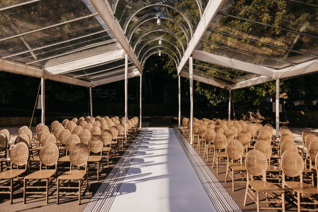 Seating under canvas with trees behind